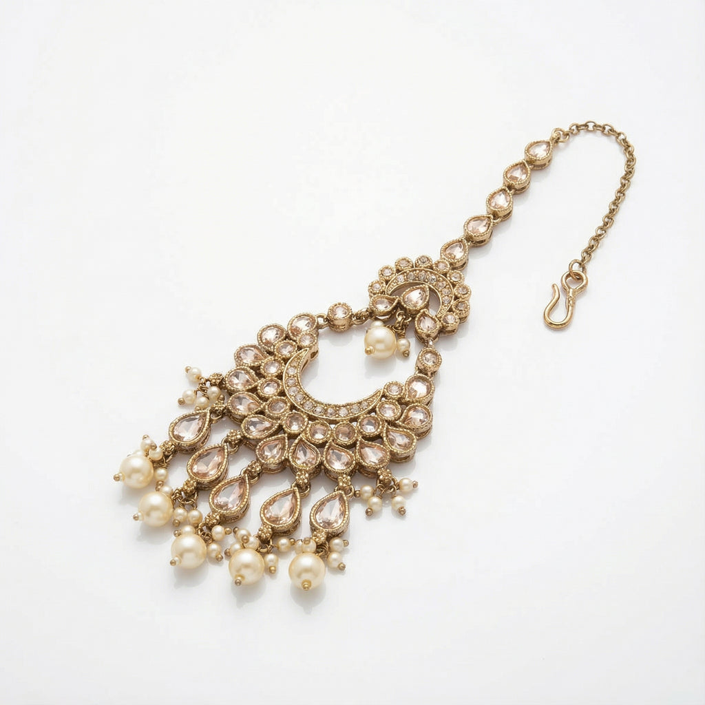 Ivory Heirloom Crescent Tikka detail showing pear-cut crystal chain, kundan crescent, and pearl fringe