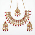 Studio flatlay of the ruby heirloom necklace set with matching earrings.