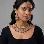 South Asian woman wearing the ruby heirloom necklace set — bridal look.