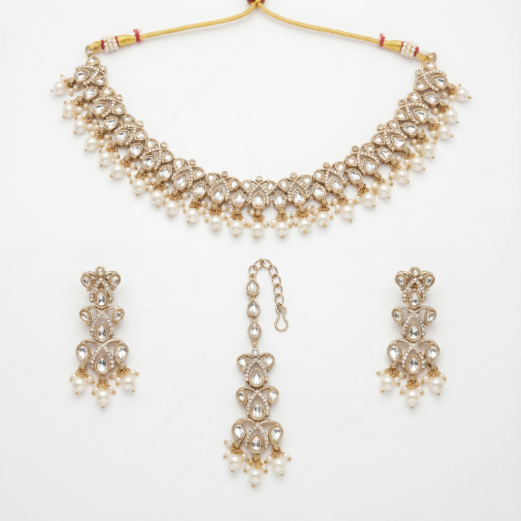 Sitara Pearl Polki Set gold choker with earrings and maang tikka on white background