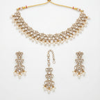 Sitara Pearl Polki Set gold choker with earrings and maang tikka on white background