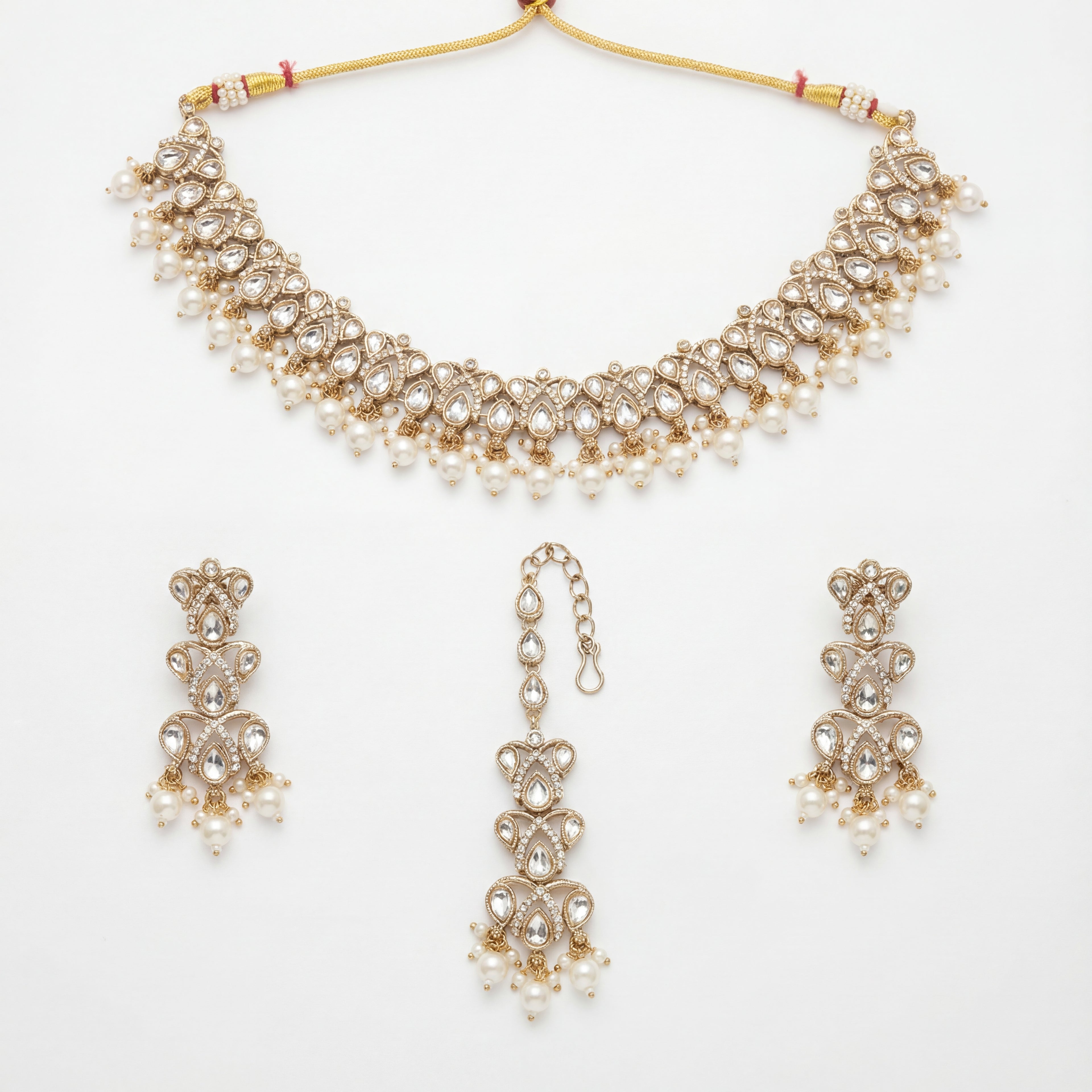 Sitara Pearl Polki Set gold choker with earrings and maang tikka on white background