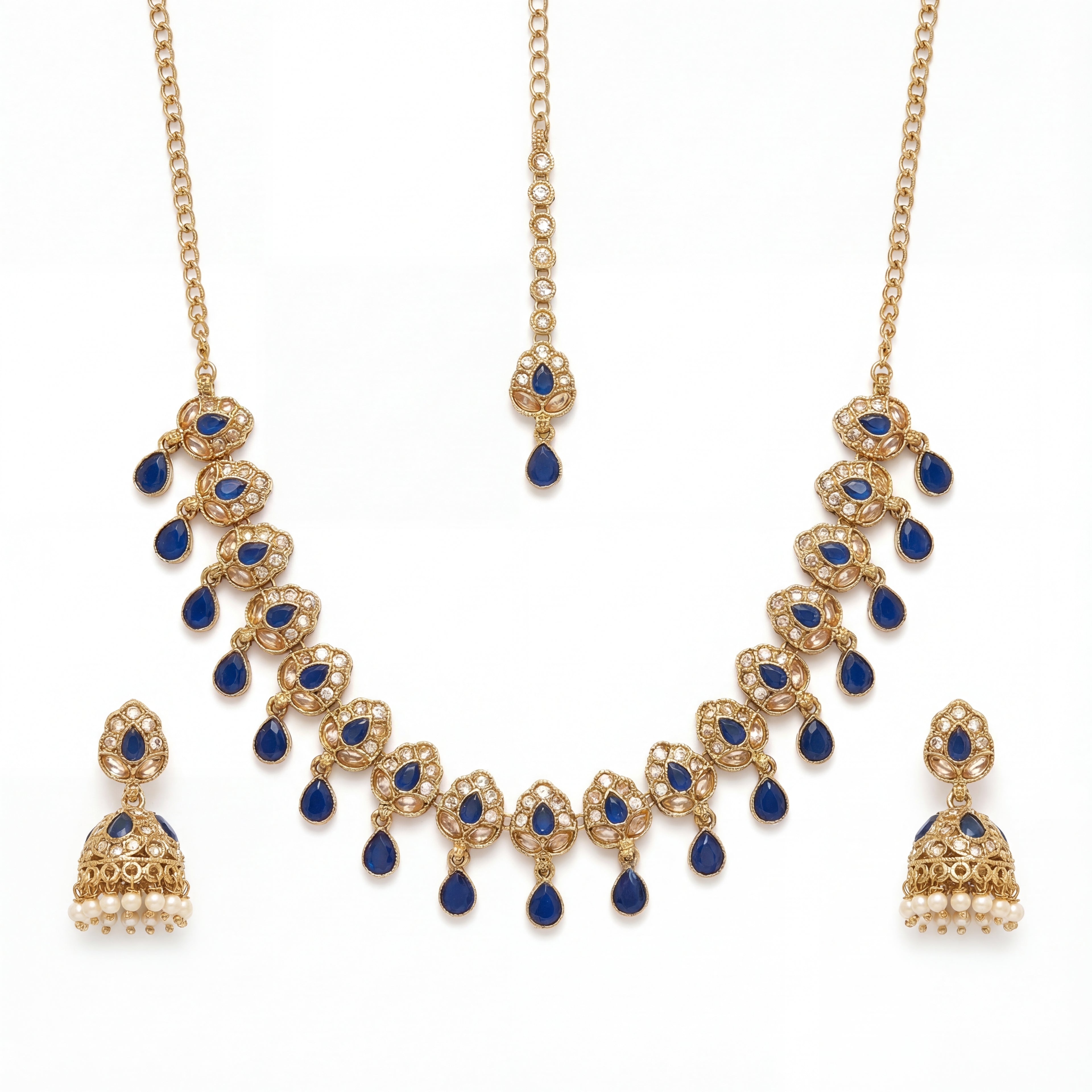 Studio flatlay of the gold-tone polki necklace with matching earrings