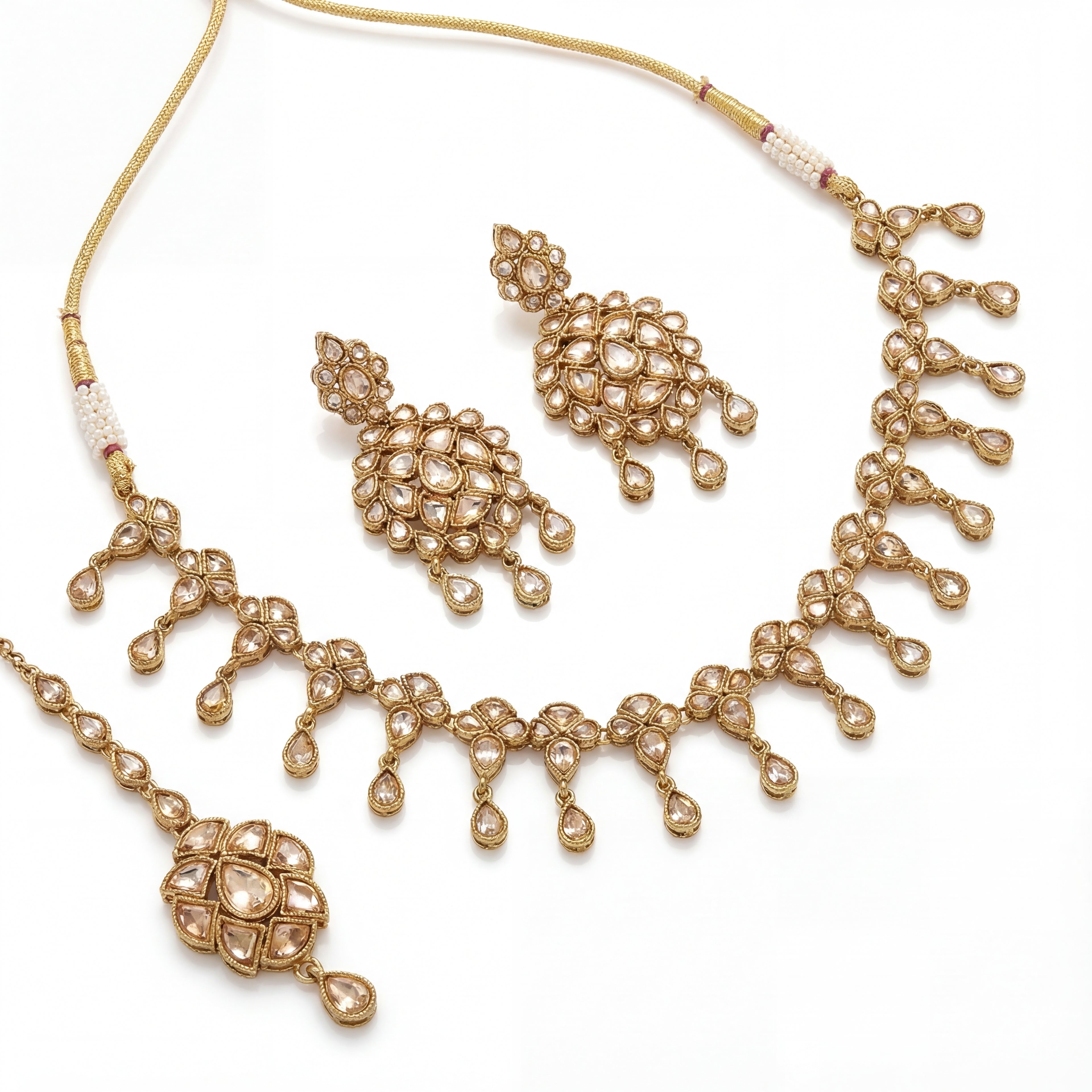 Studio flatlay of the silver-toned signature set with matching earrings.