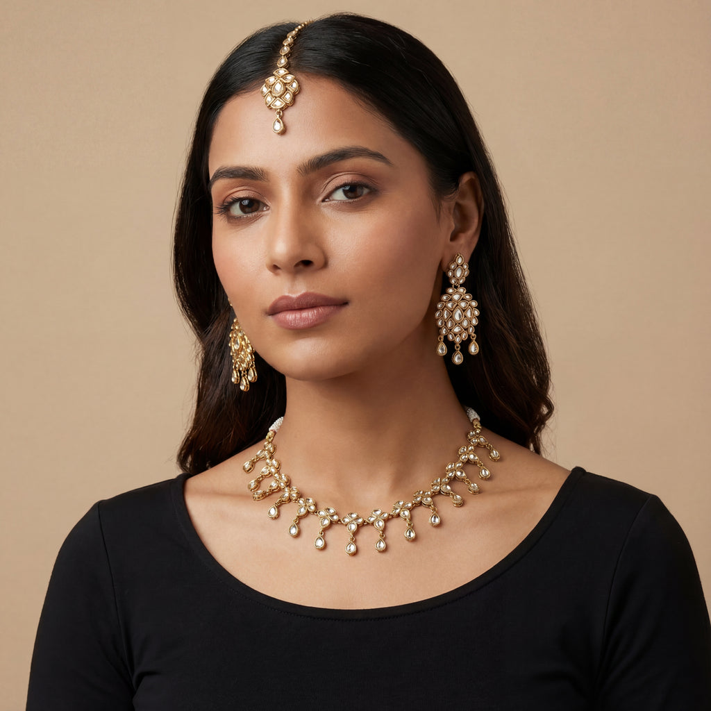 South Asian woman wearing the silver-toned signature set — bridal look.