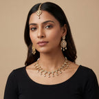 South Asian woman wearing the silver-toned signature set — bridal look.