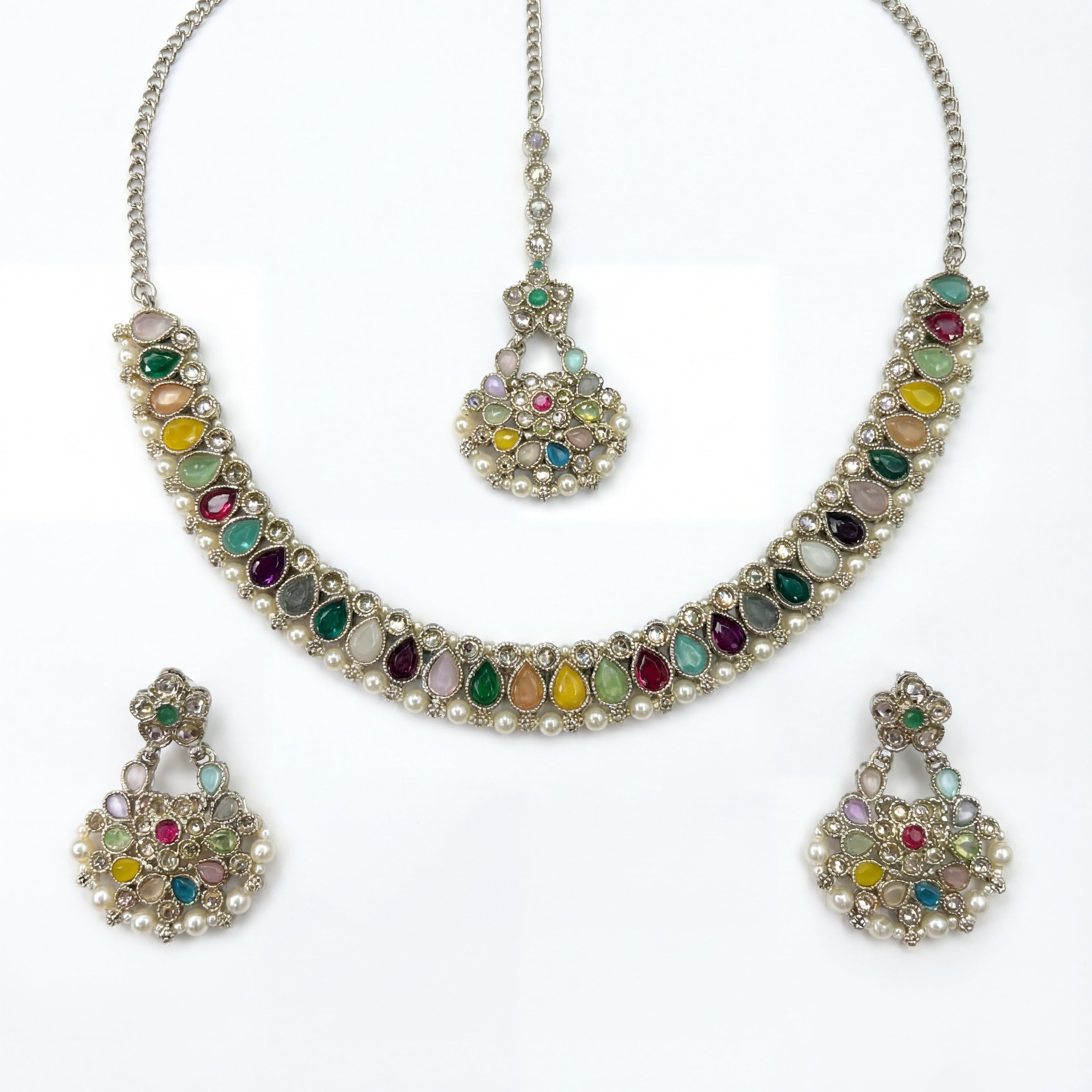 Studio flatlay of the polki necklace set with matching earrings.