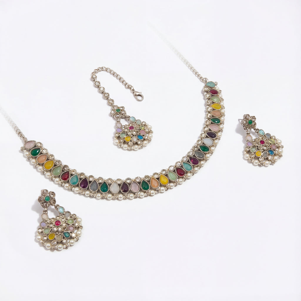 Detail flatlay of the polki necklace set, highlighting the stonework and earrings.