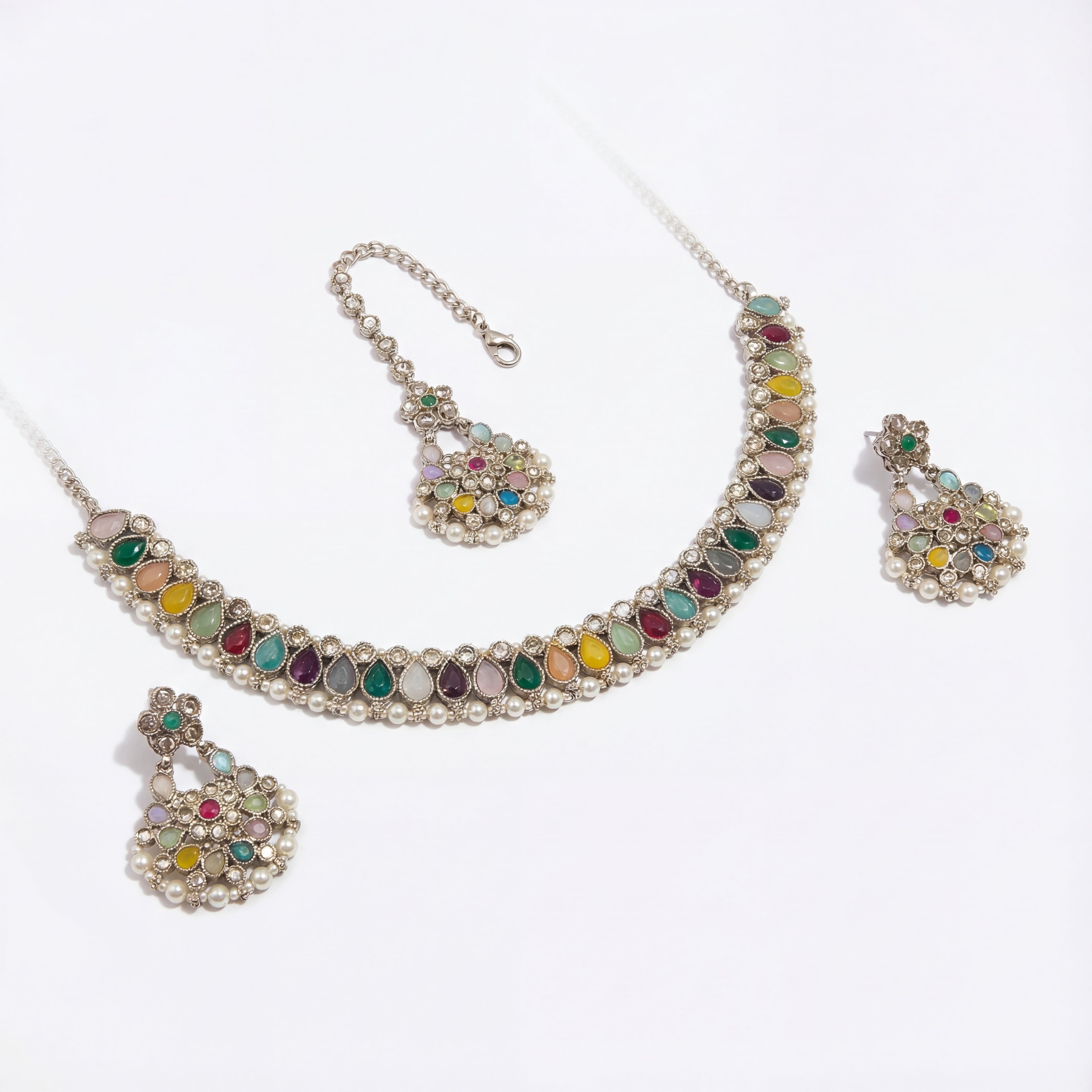 Detail flatlay of the polki necklace set, highlighting the stonework and earrings.