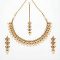 Studio flatlay of the ivory pearl necklace set with matching earrings.