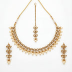 Studio flatlay of the ivory pearl necklace set with matching earrings.