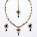 Studio flatlay of the silver-tone noir kundan necklace with matching earrings