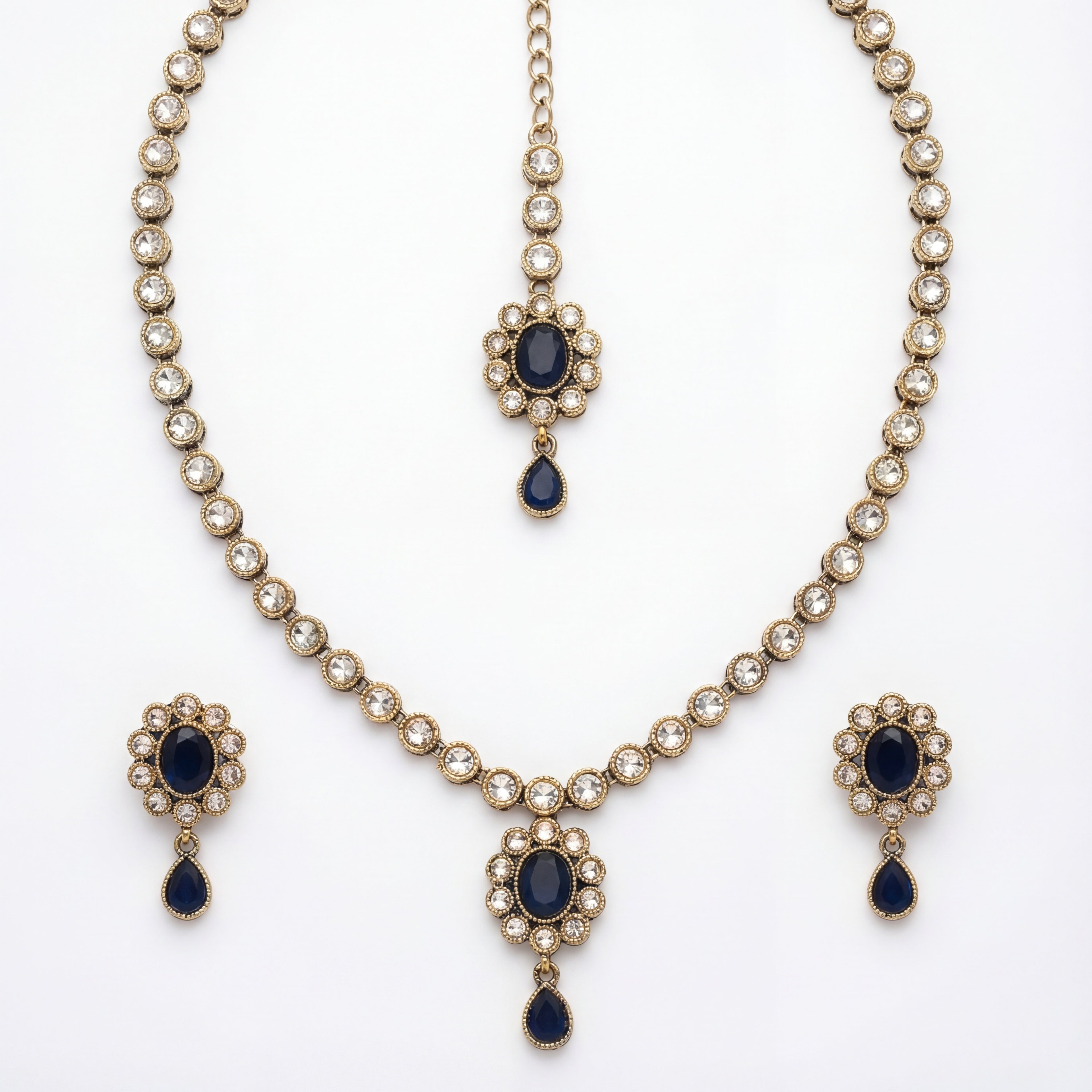 Studio flatlay of the silver-tone noir kundan necklace with matching earrings