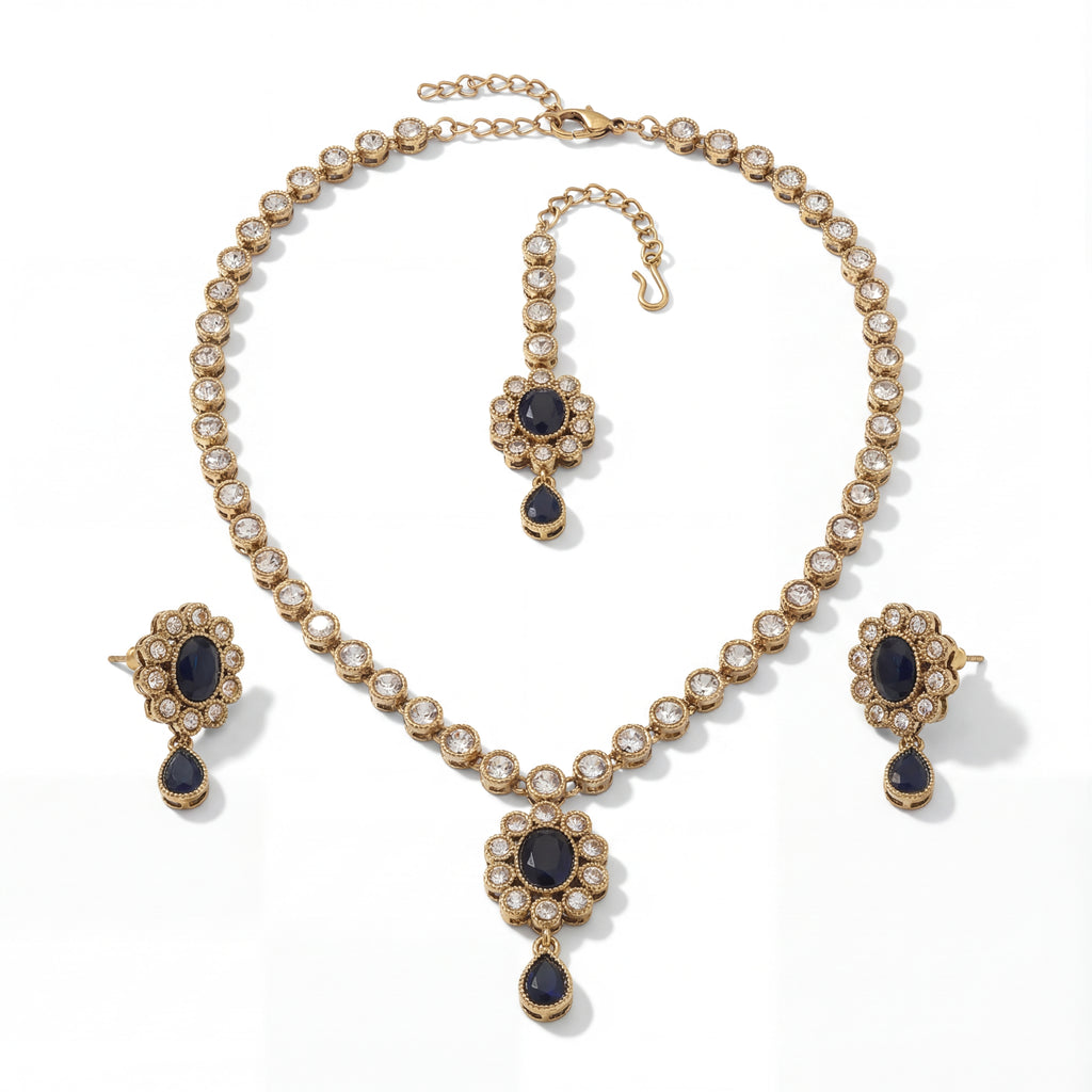 Detail flatlay of the silver-tone noir kundan necklace and matching earrings with black accents