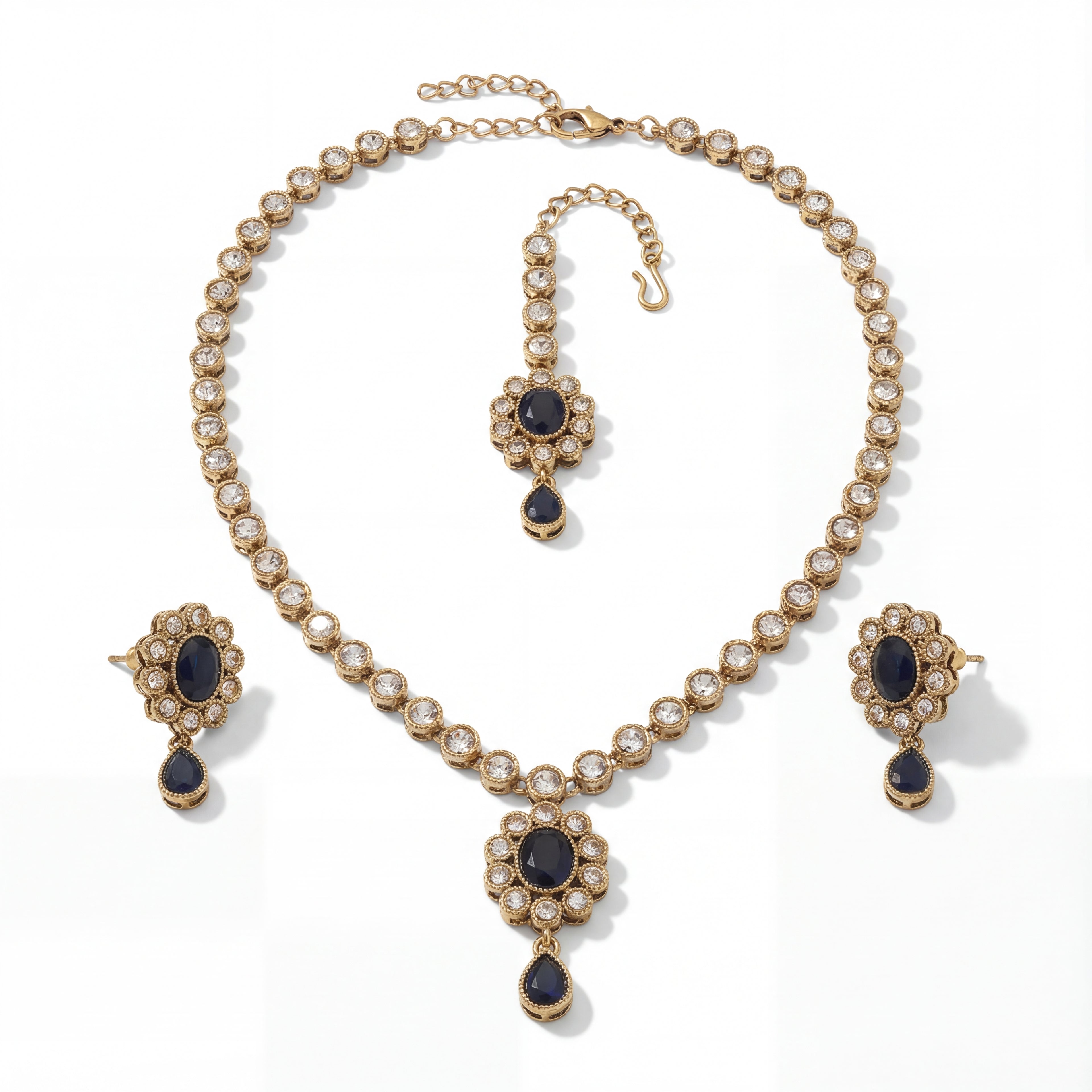 Detail flatlay of the silver-tone noir kundan necklace and matching earrings with black accents