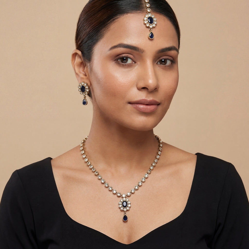 South Asian woman wearing the silver-tone noir kundan necklace with matching earrings — bridal look