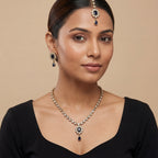 South Asian woman wearing the silver-tone noir kundan necklace with matching earrings — bridal look