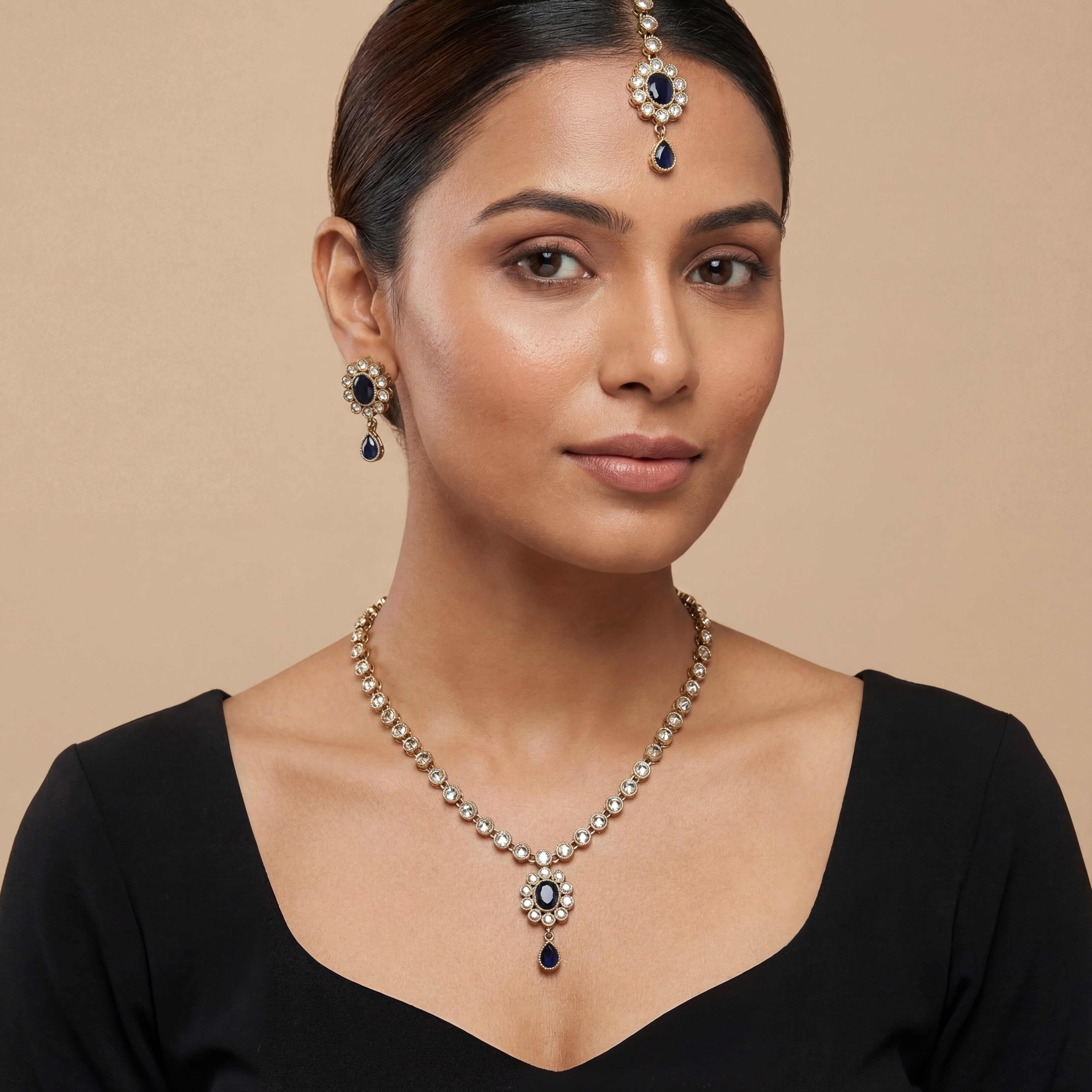 South Asian woman wearing the silver-tone noir kundan necklace with matching earrings — bridal look