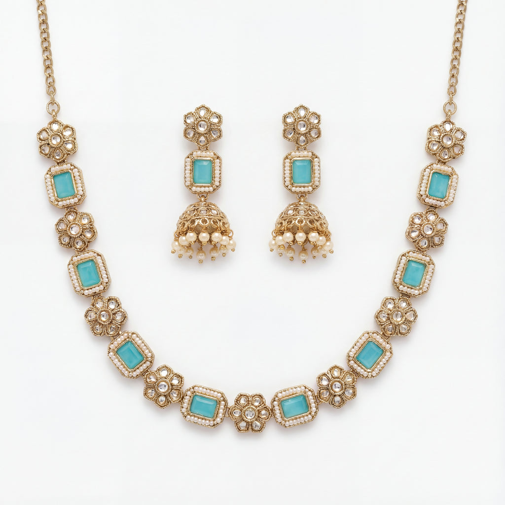 Studio flatlay of the aqua necklace set with matching earrings.