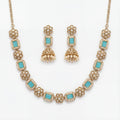 Studio flatlay of the aqua necklace set with matching earrings.