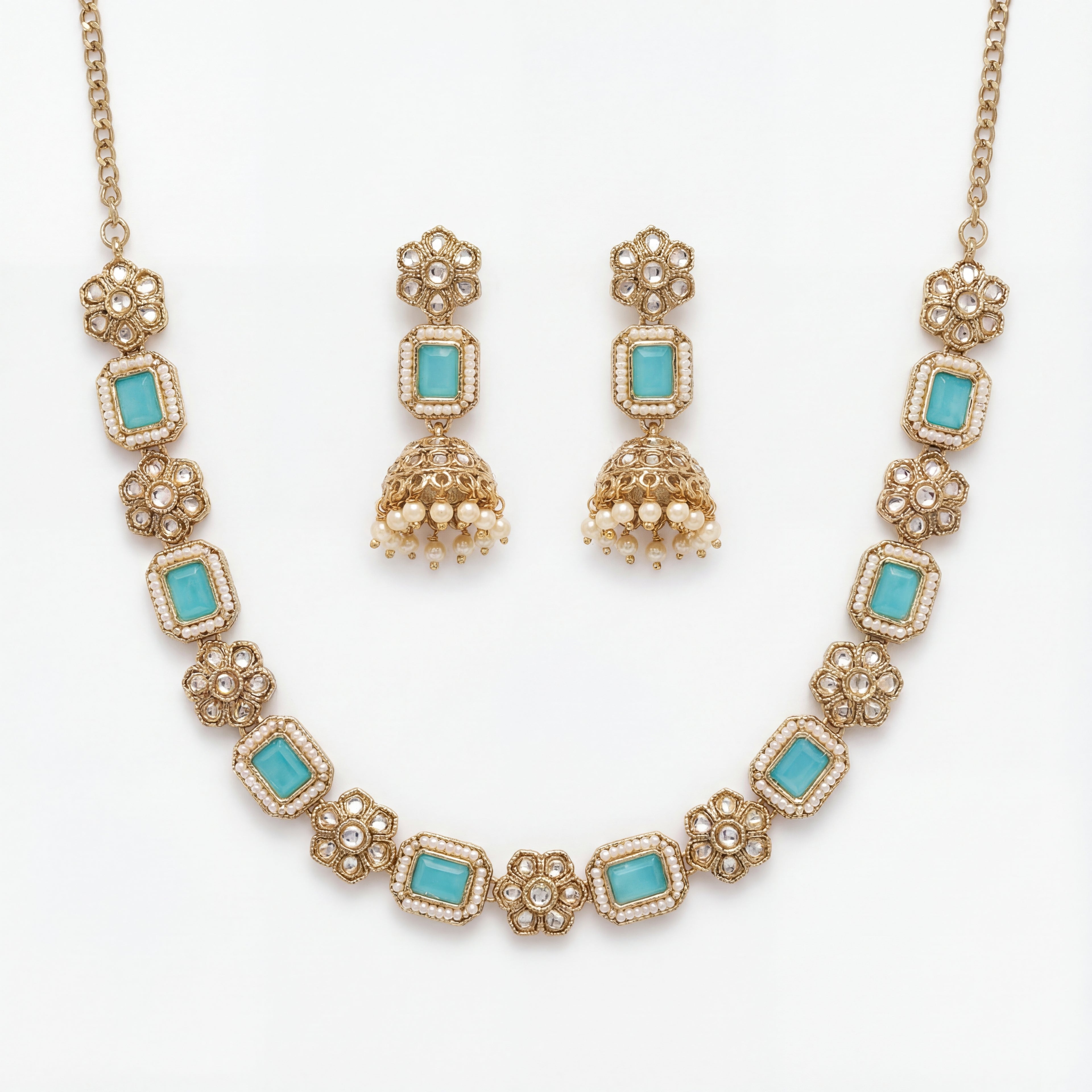 Studio flatlay of the aqua necklace set with matching earrings.