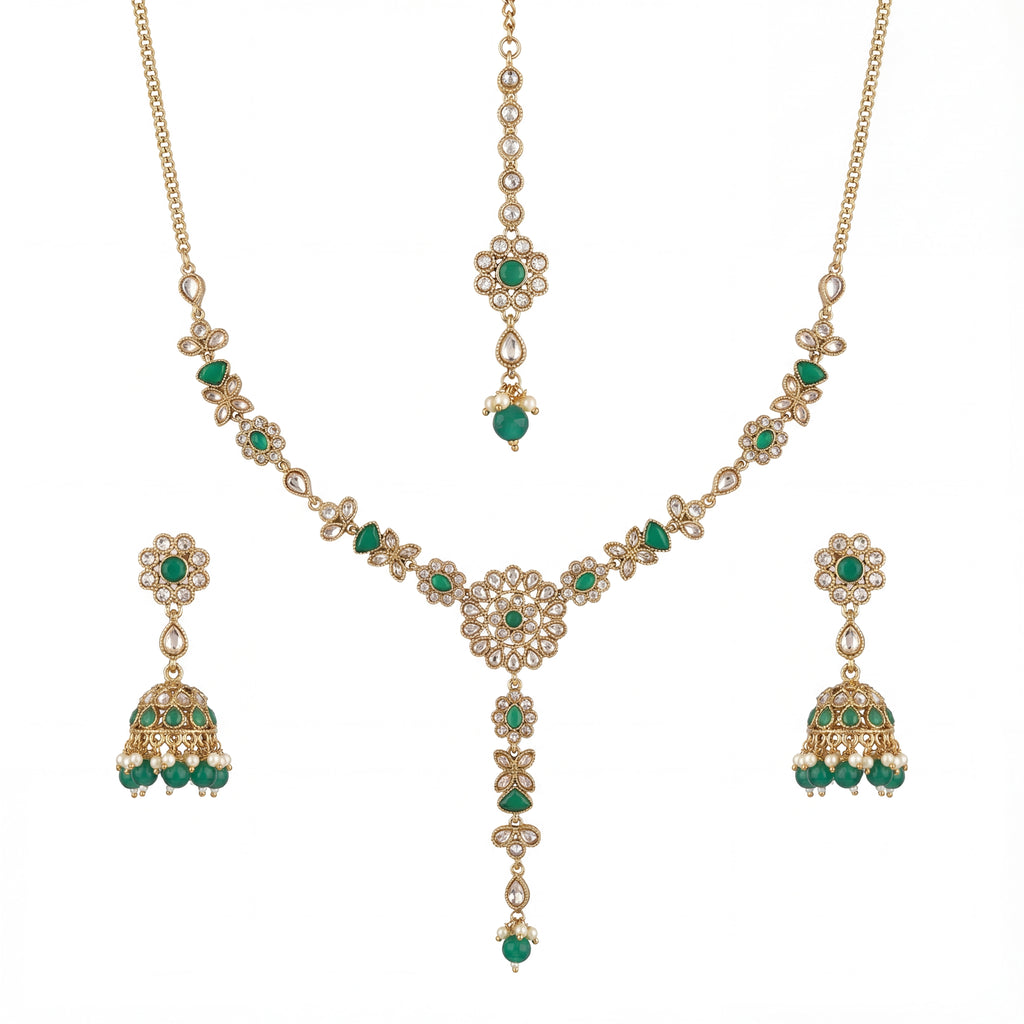 Studio flatlay of the emerald heirloom necklace set with matching earrings.