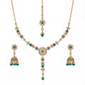 Studio flatlay of the emerald heirloom necklace set with matching earrings.
