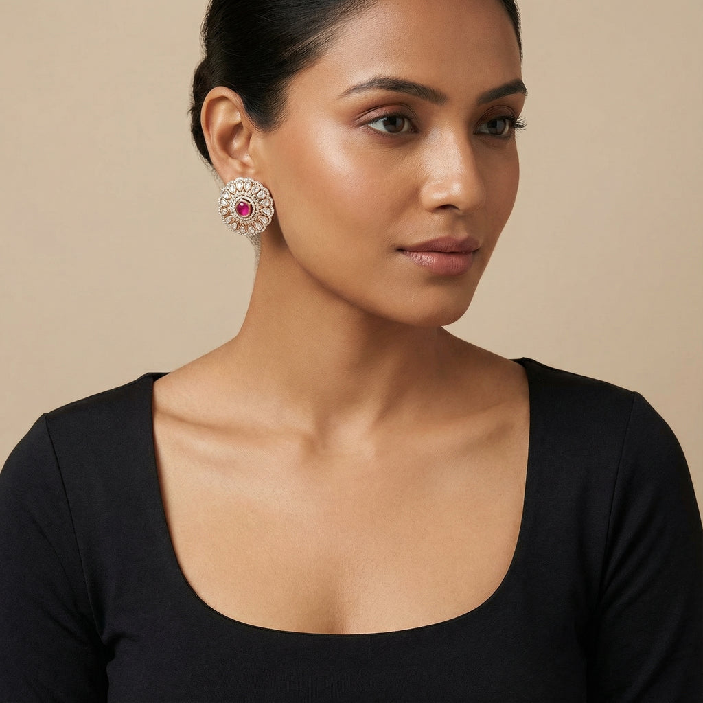 Close-up of Ruhani Ruby Petal Stud Earrings showing floral detailing and rich jewel-toned accents and gold-plated finish