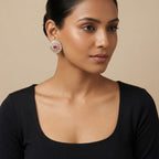 Close-up of Ruhani Ruby Petal Stud Earrings showing floral detailing and rich jewel-toned accents and gold-plated finish