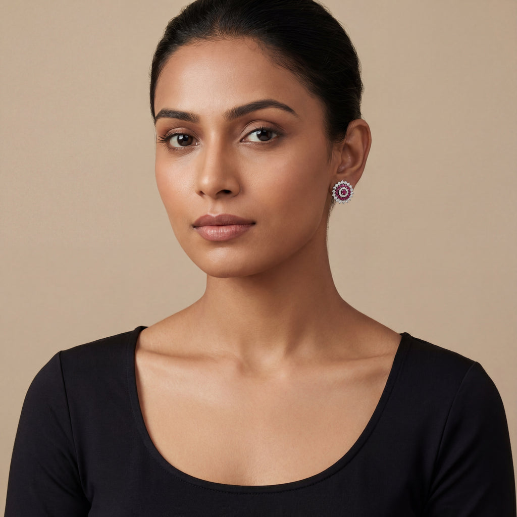 Close-up of Ruhani Pink Glow Stud Earrings showing rich jewel-toned accents and gold-plated finish