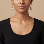 Close-up of Ruhani Pearl Orbit Earrings showing pearl accents and gold-plated finish