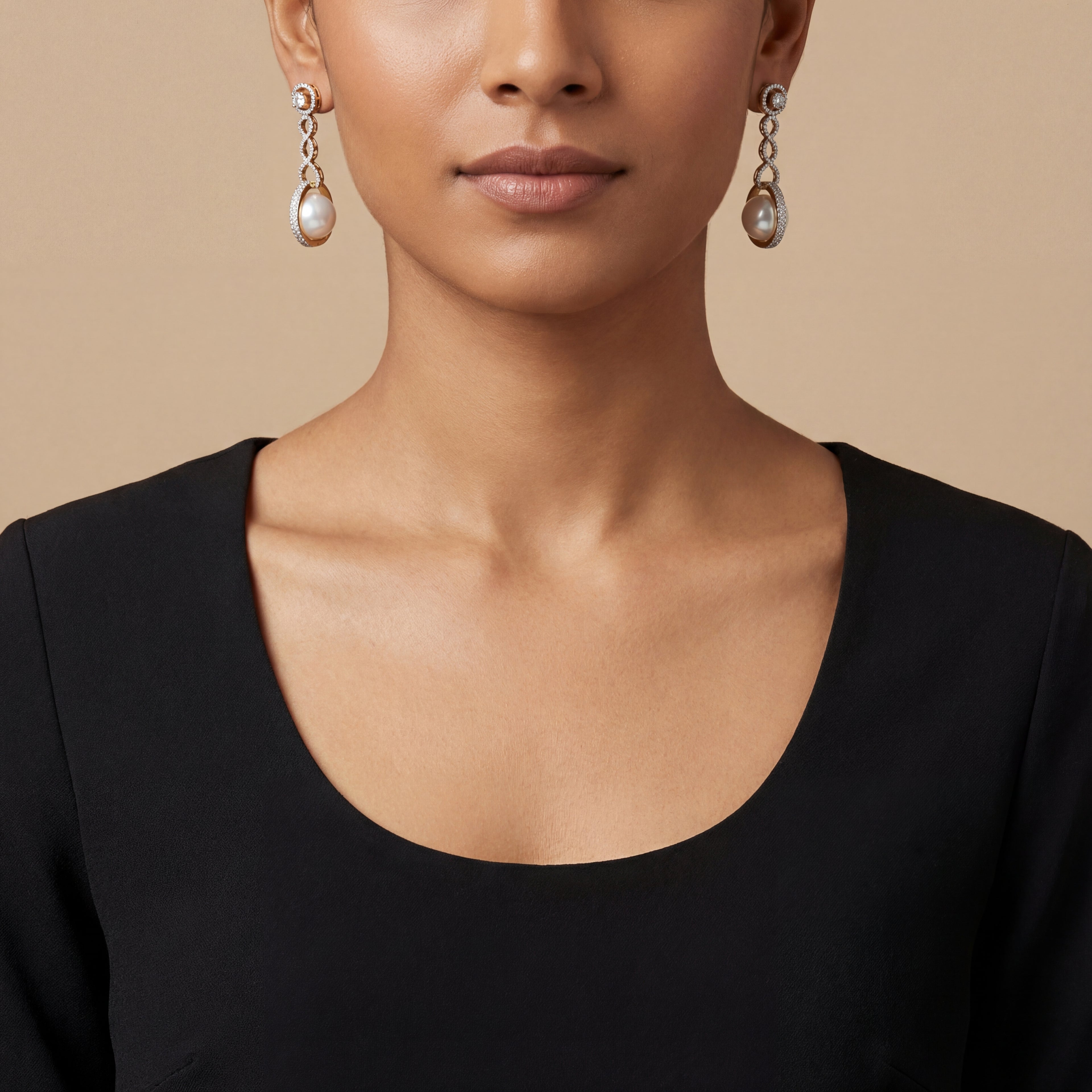 Close-up of Ruhani Pearl Orbit Earrings showing pearl accents and gold-plated finish