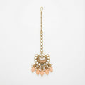 Ziya Crescent Tikka gold maang tikka with mirror kundan links and peach crescent pendant on gray background