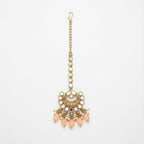 Ziya Crescent Tikka gold maang tikka with mirror kundan links and peach crescent pendant on gray background