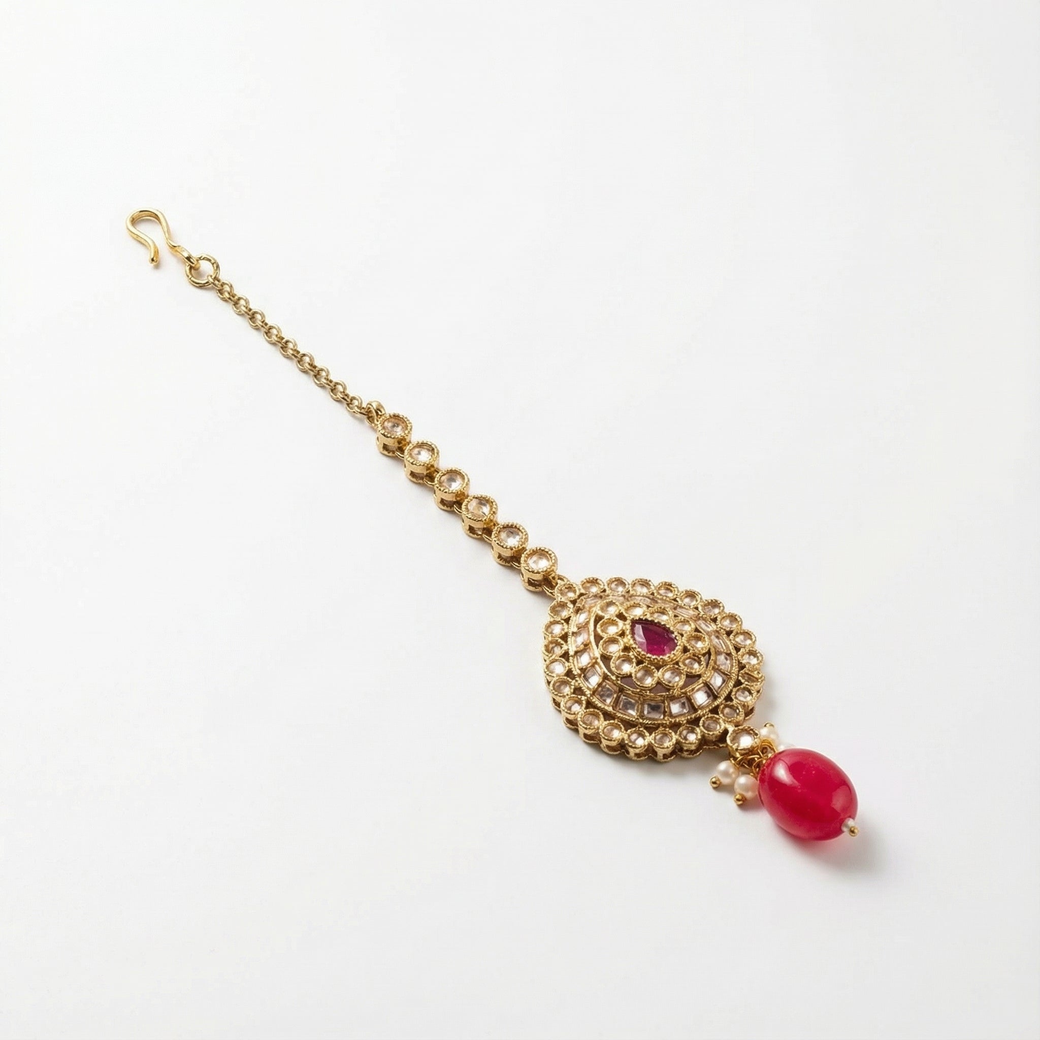 Mehru Ruby Medallion Tikka detail showing pavé teardrop medallion and pink oval dangle