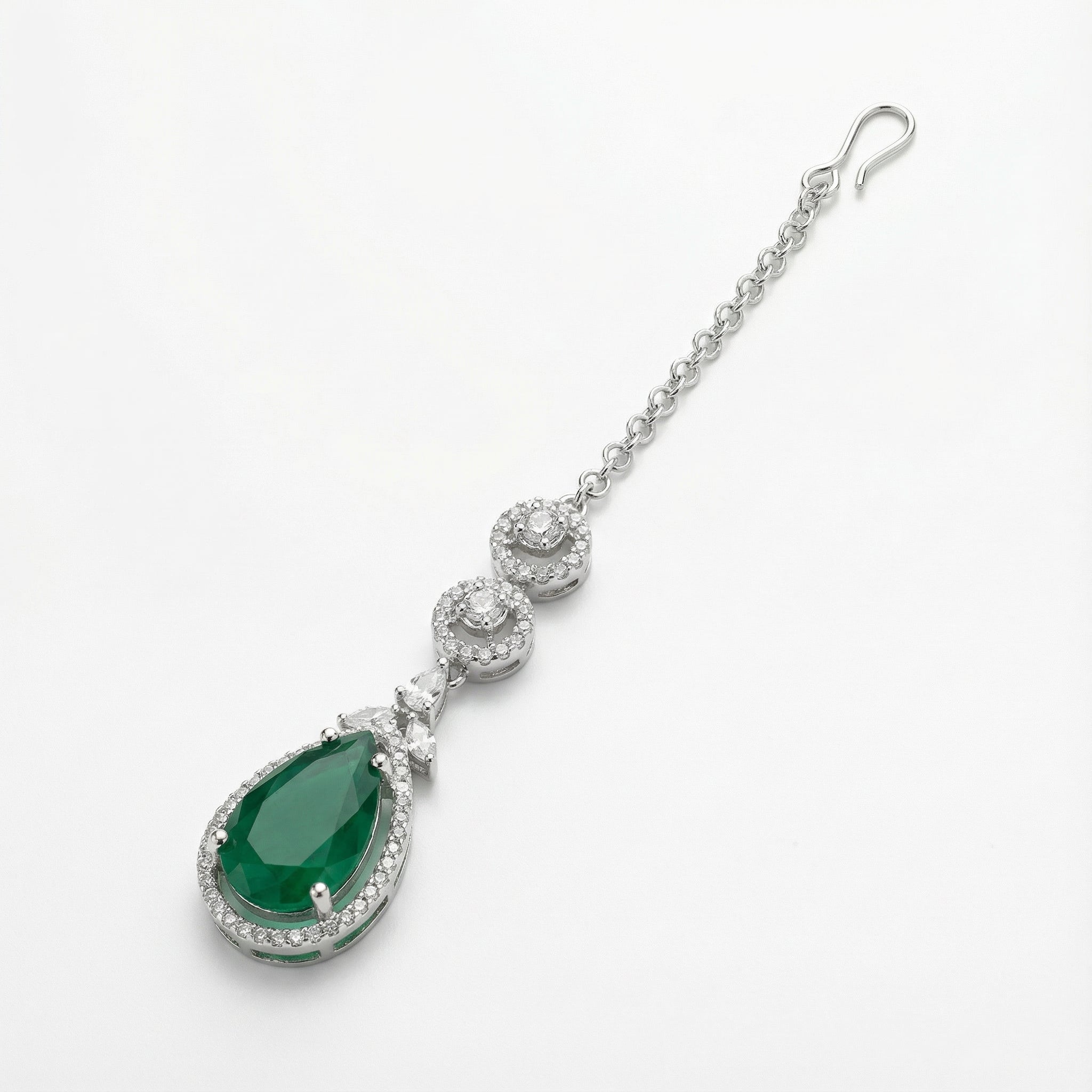 Zayna Emerald Statement Tikka detail showing stacked crystal circles and green pear center stone