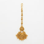 Anika Temple Drop Tikka antique gold-tone temple maang tikka with beaded fringe on gray background