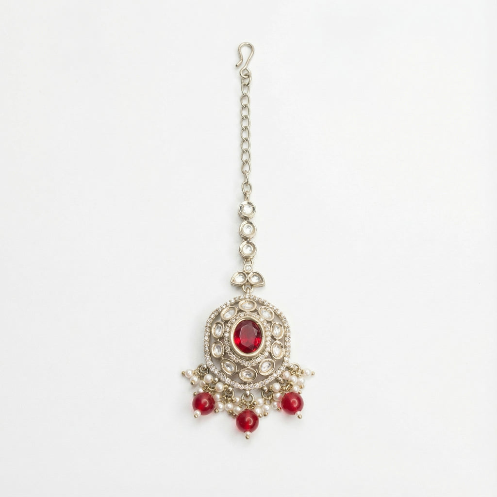 Saffiya Ruby Polki Tikka silver polki maang tikka with red center and red bead pearl fringe on gray background
