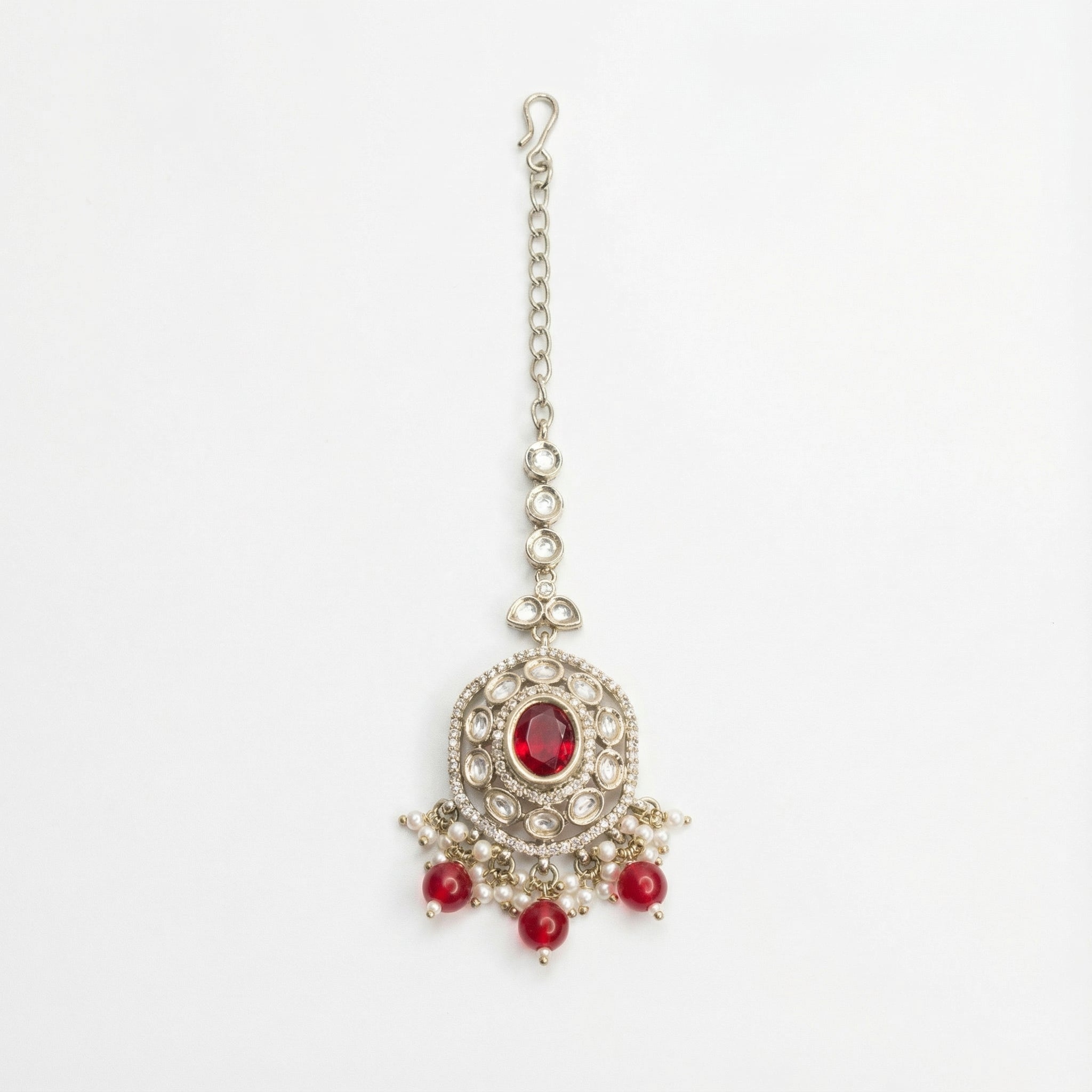 Saffiya Ruby Polki Tikka silver polki maang tikka with red center and red bead pearl fringe on gray background