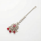 Saffiya Ruby Polki Tikka detail showing radial clear stones, red oval center, and dangling red beads