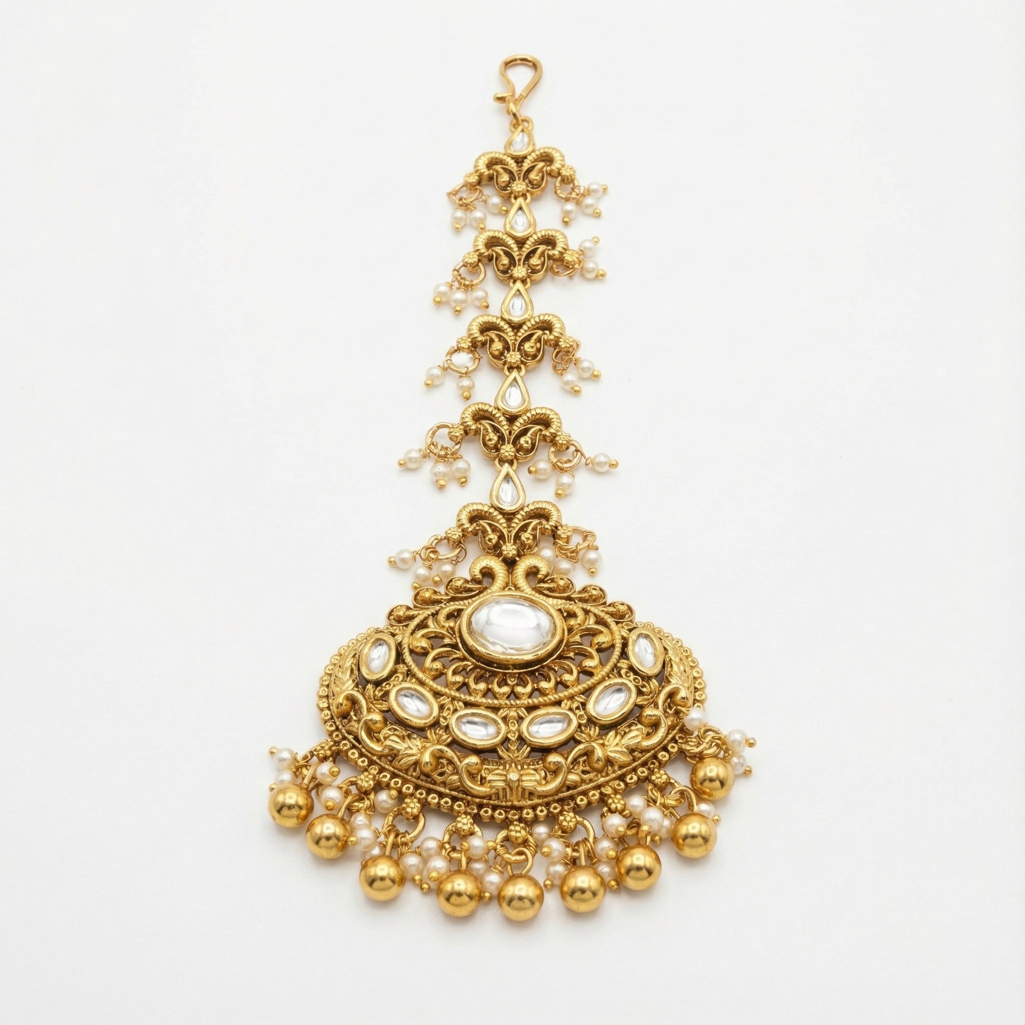 Chandrika Pearl Crest Tikka gold-tone kundan maang tikka with pearl fringe on gray background
