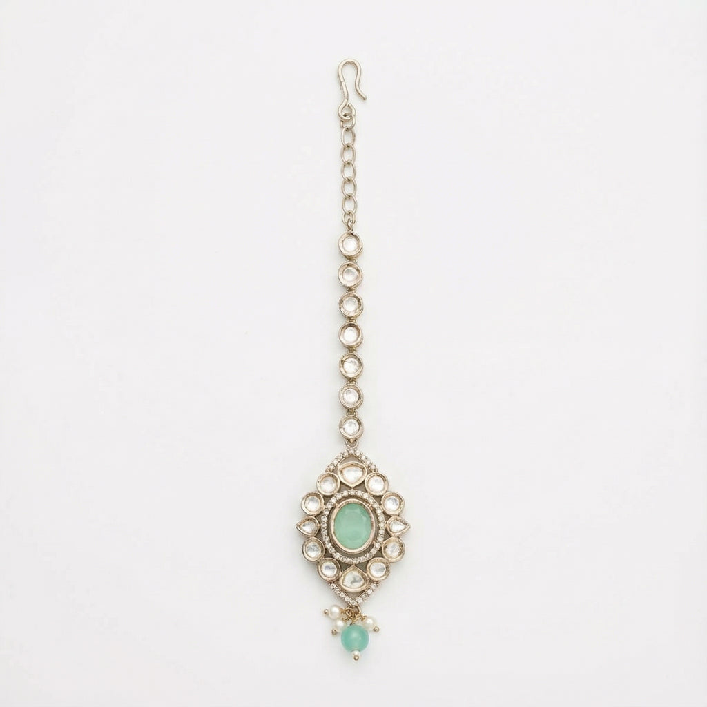 Serene Mint Halo Tikka silver kite maang tikka with mint green center on gray background