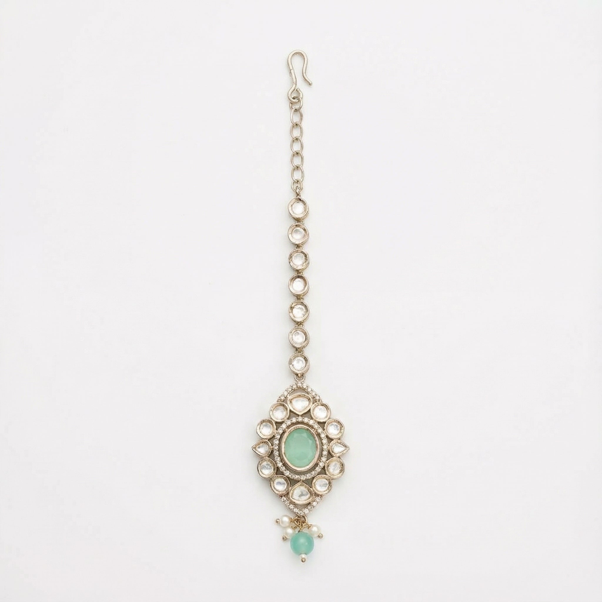 Serene Mint Halo Tikka silver kite maang tikka with mint green center on gray background