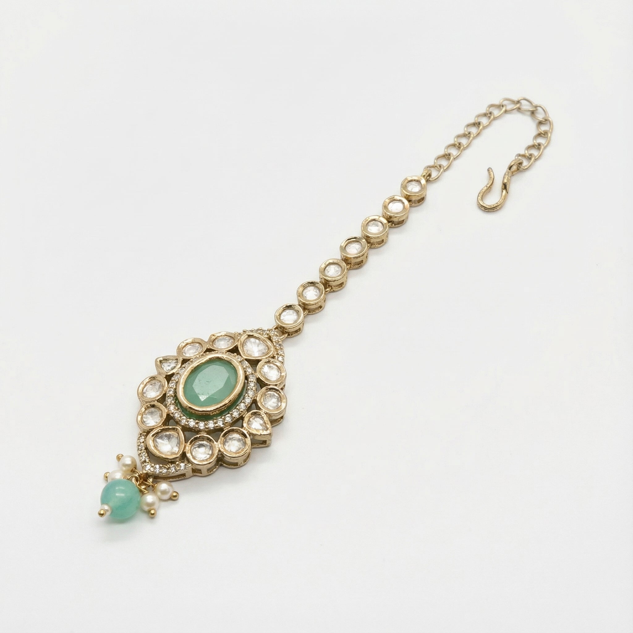 Serene Mint Halo Tikka detail showing crystal border, mint oval stone, and green pearl drop cluster