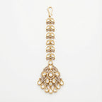 Aranya Polki Chandelier Tikka gold chandelier maang tikka with polki pendant and teardrop charms on gray background