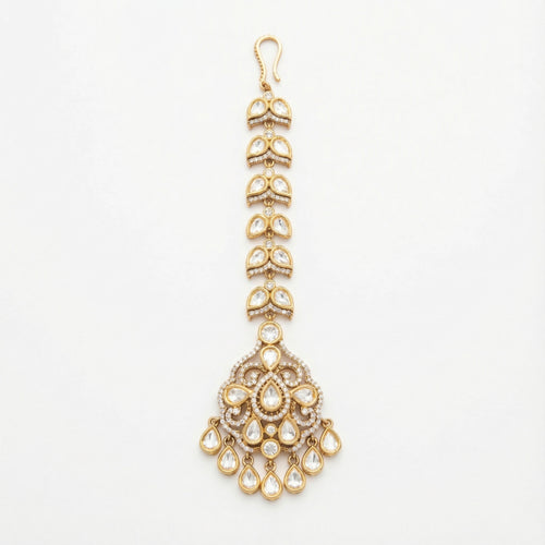 Aranya Polki Chandelier Tikka gold chandelier maang tikka with polki pendant and teardrop charms on gray background