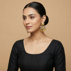 Haldi Crest Statement Earrings detail showing crescent lotus panel and yellow teardrop fringe