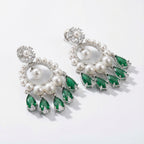 Emerald Halo Drop Earrings detail showing pearl rim and green teardrop fringe
