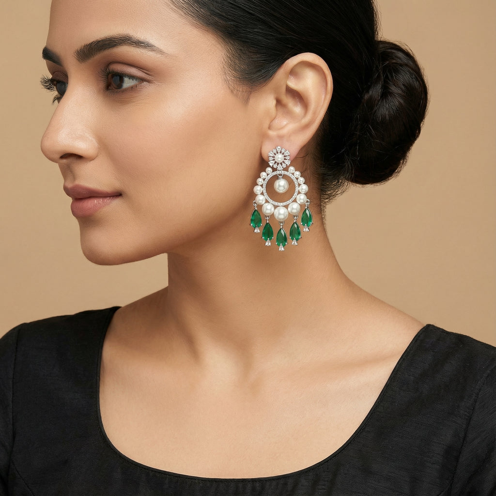 Emerald Halo Drop Earrings detail showing pearl rim and green teardrop fringe