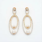 Orbitline Drop Earrings two-tone nested oval drops with pavé crystals and pearls on white background